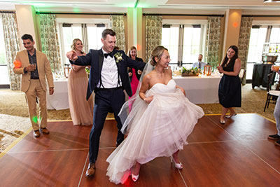 Bride and groom dancing on dancefloor