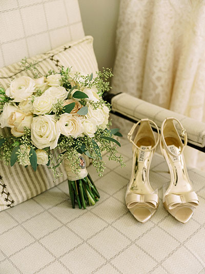 Wedding shows and bouquet on armchair