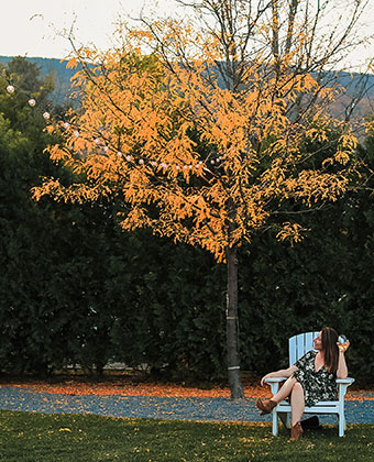 girl on chair outside at hotel