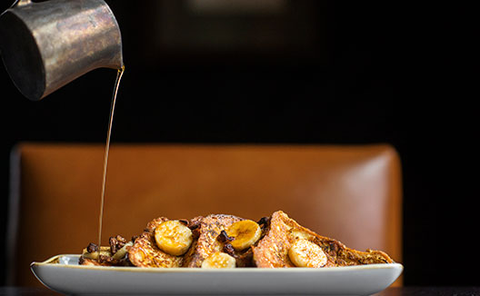 French Toast with bananas and syrup